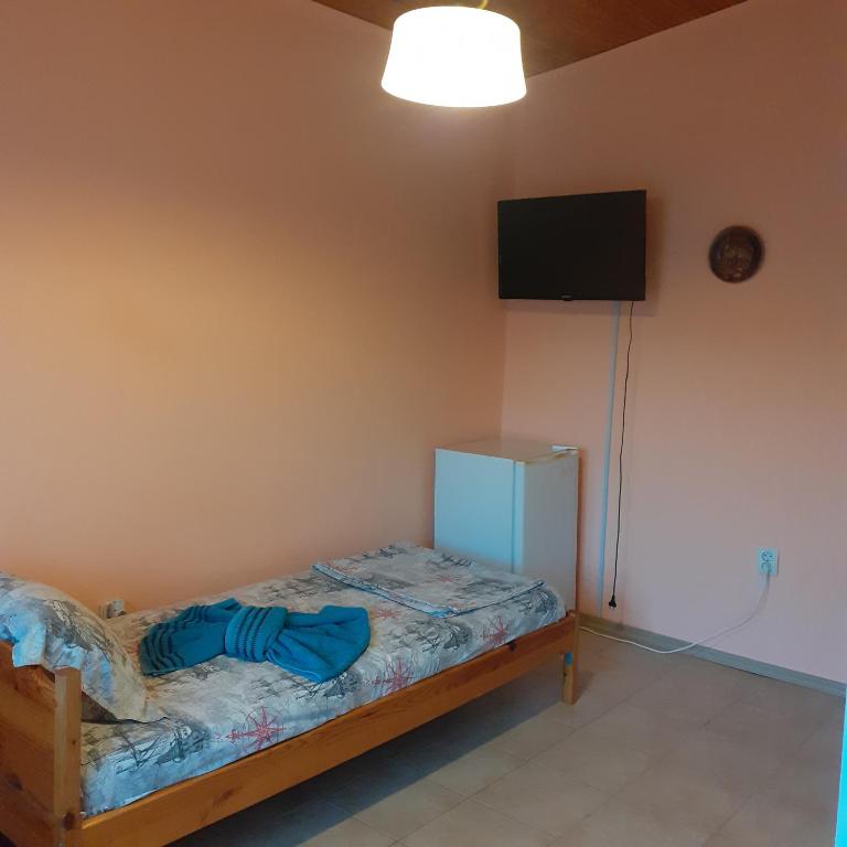 Postel nebo postele na pokoji v ubytování Guest House Sun