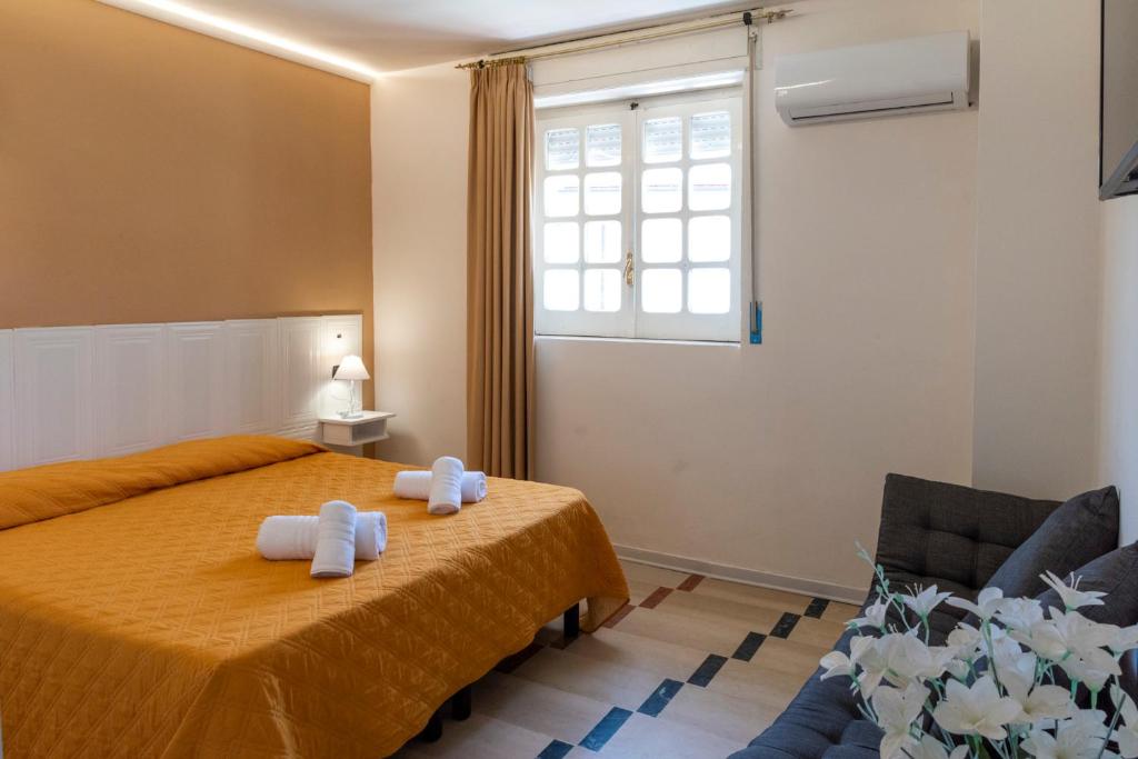 Postel nebo postele na pokoji v ubytování SOLARIS PAESTUM