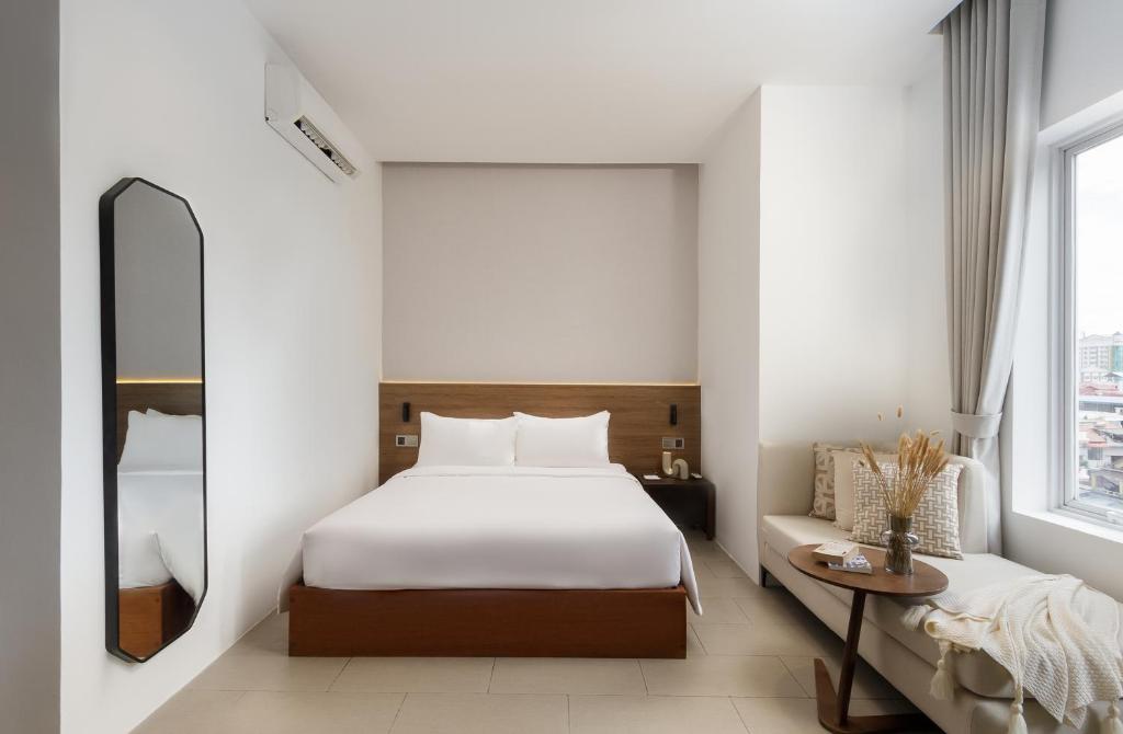 Postel nebo postele na pokoji v ubytování WH Hotel 310