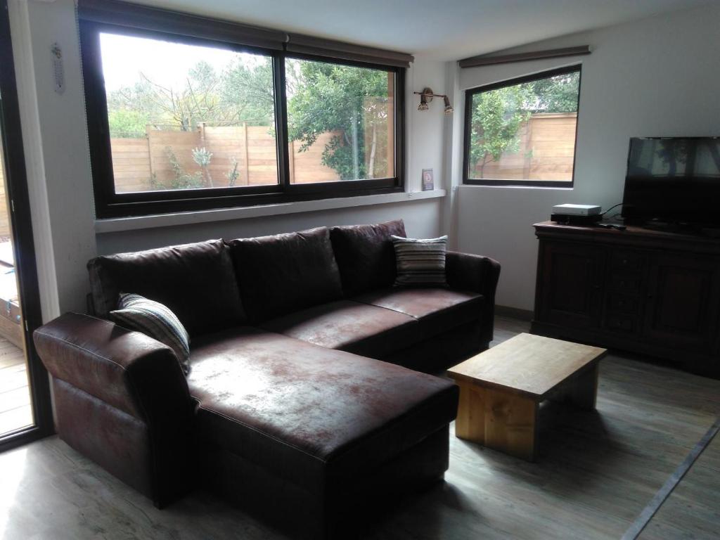 a living room with a couch and a coffee table at Gîte location de vacances : G2735 in Saint-Maximin-la-Sainte-Baume