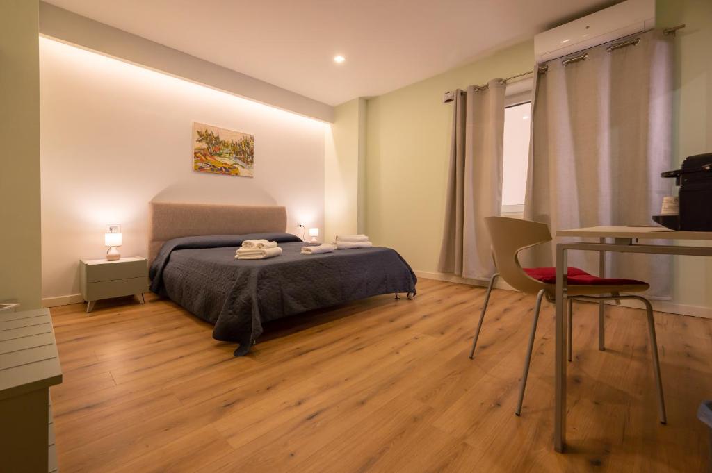 Postel nebo postele na pokoji v ubytování LA META ROOMS