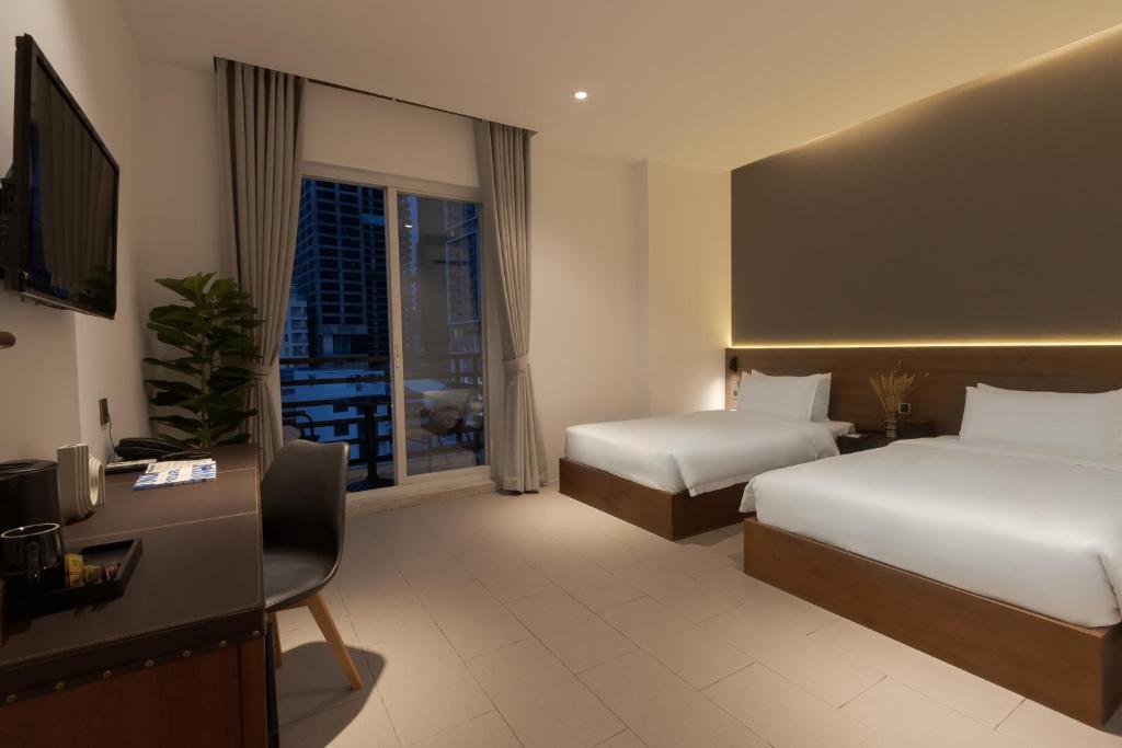 Postel nebo postele na pokoji v ubytování WH Hotel 310