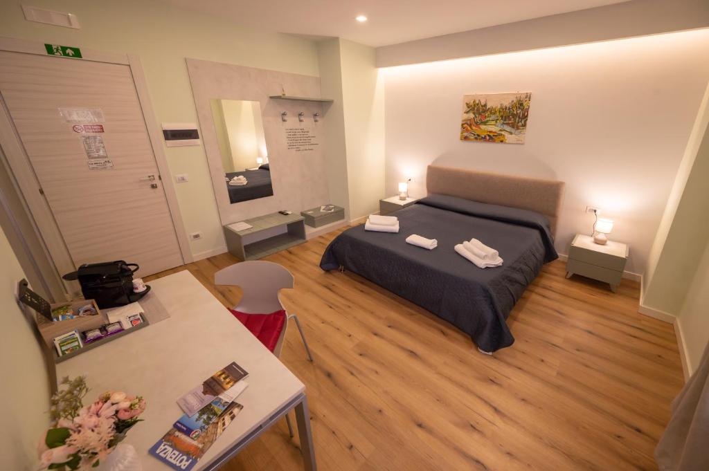 Postel nebo postele na pokoji v ubytování LA META ROOMS
