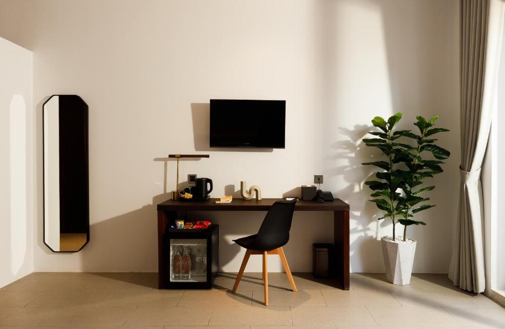 TV a/nebo společenská místnost v ubytování WH Hotel 310