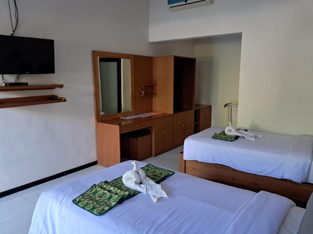Postel nebo postele na pokoji v ubytování Avana Hotel & Dive Center Pemuteran