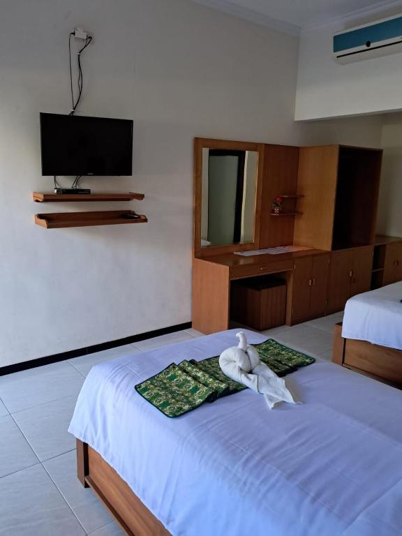 Postel nebo postele na pokoji v ubytování Avana Hotel & Dive Center Pemuteran