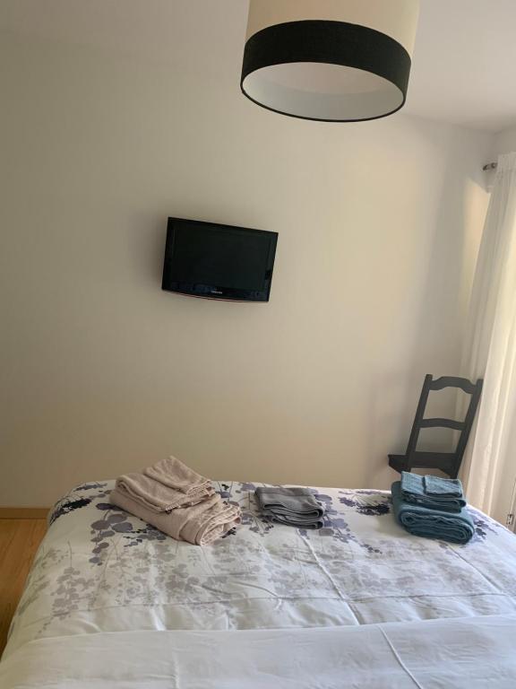 Postel nebo postele na pokoji v ubytování Comme sur un nuage, appartement pour 4 personnes