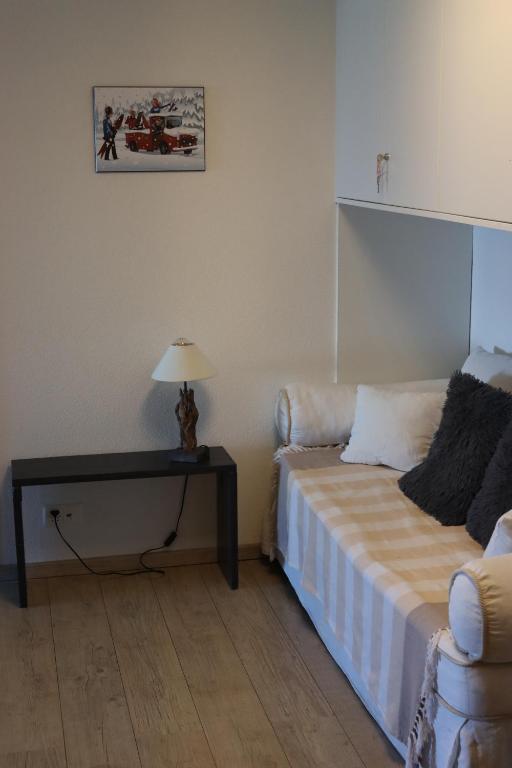Postel nebo postele na pokoji v ubytování Comme sur un nuage, appartement pour 4 personnes