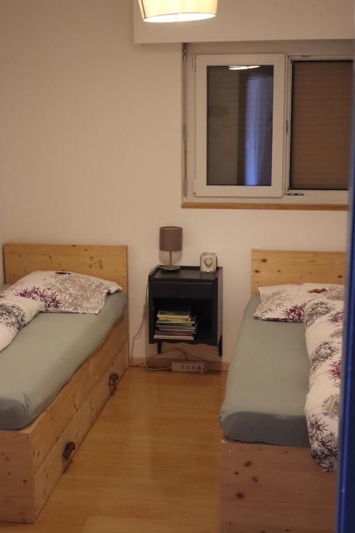 Postel nebo postele na pokoji v ubytování Comme sur un nuage, appartement pour 4 personnes