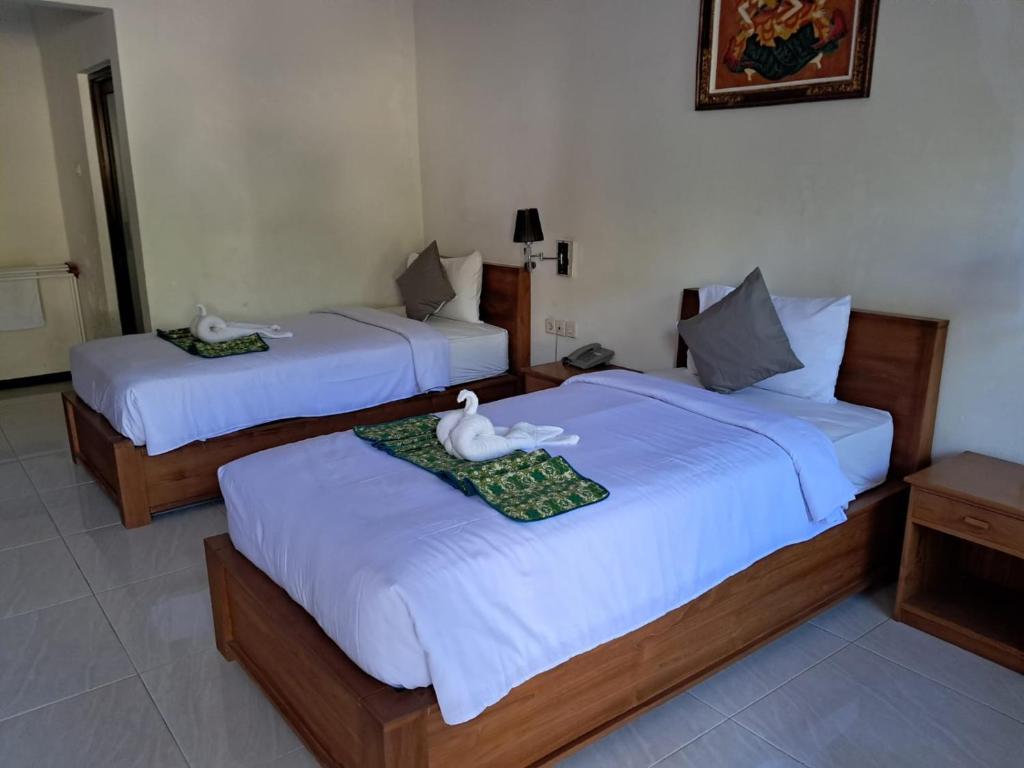 Postel nebo postele na pokoji v ubytování Avana Hotel & Dive Center Pemuteran
