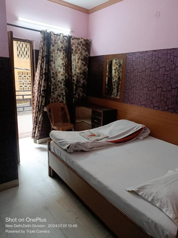 Uma cama ou camas num quarto em Mother Palace