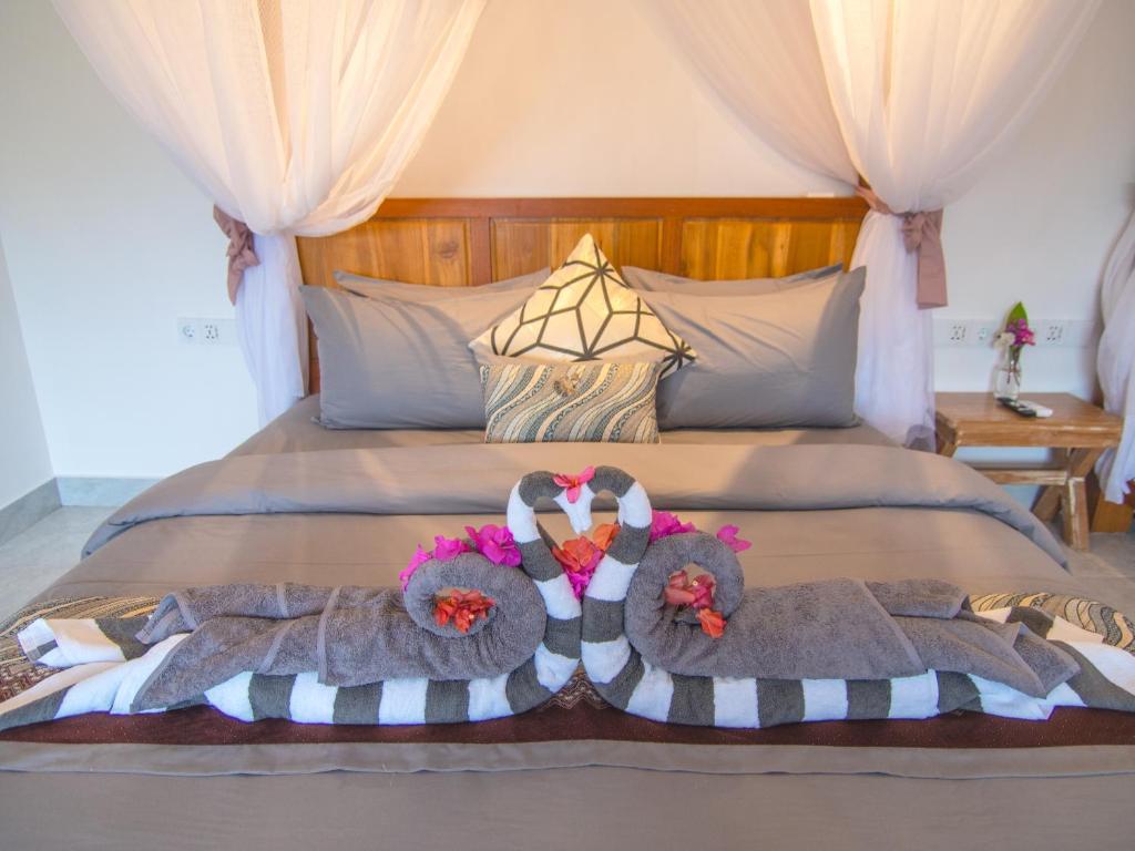 Postel nebo postele na pokoji v ubytování CoCo Breeze Spa Hotel