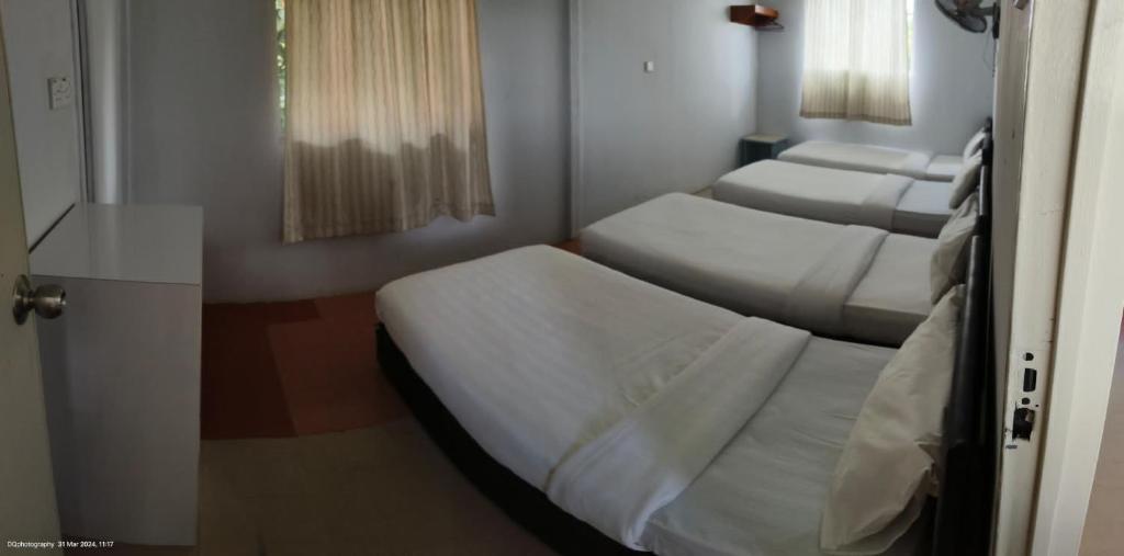 Postel nebo postele na pokoji v ubytování janice's villa