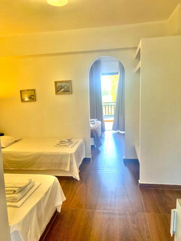 Postel nebo postele na pokoji v ubytování Hotel Paradise Ouranoupolis