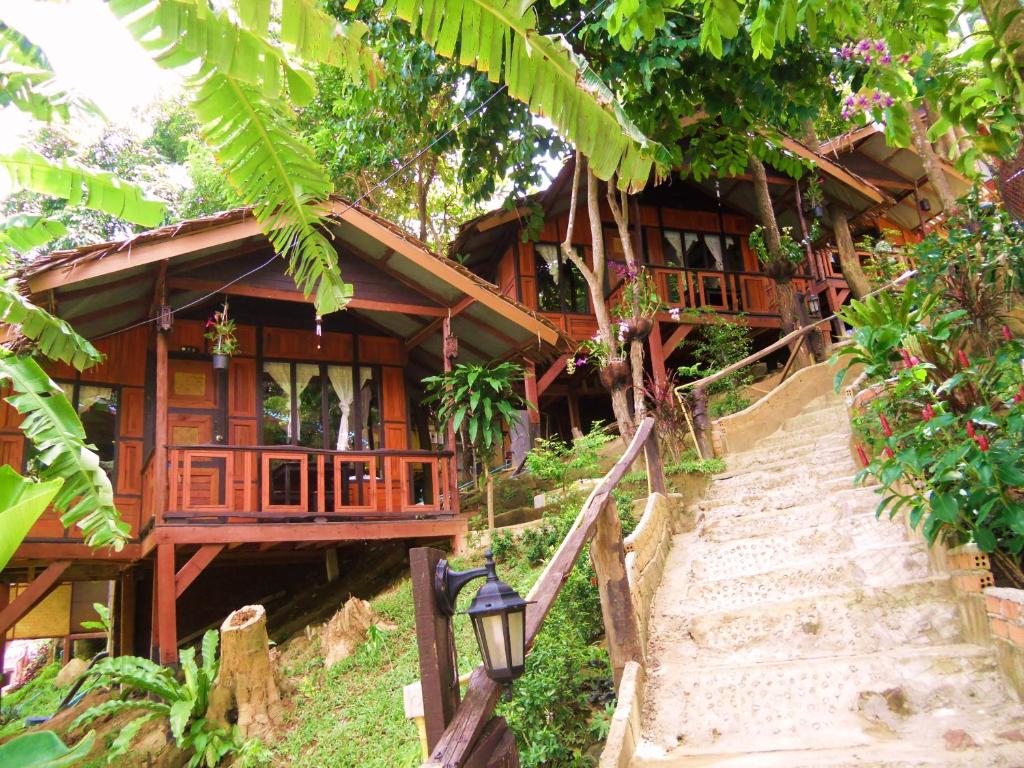 a house with a staircase leading up to it at Phi Phi Green Hill Resort in Phi Phi Don