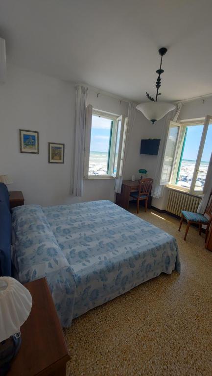 Postel nebo postele na pokoji v ubytování Albergo Regina