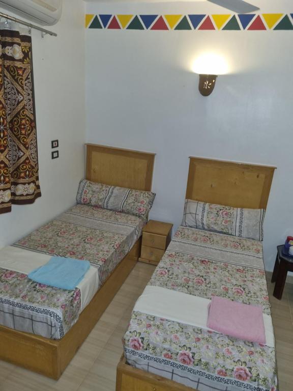 Postel nebo postele na pokoji v ubytování ABAZIDO Nubian Guest House