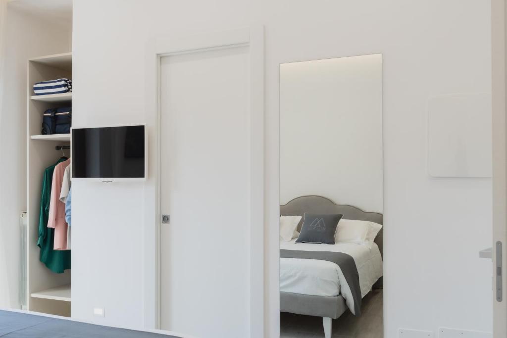 Postel nebo postele na pokoji v ubytování MIFRA SUITES