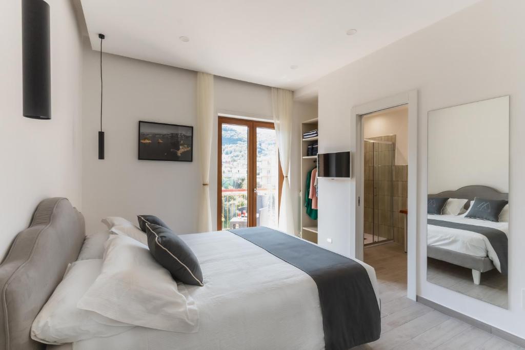 Postel nebo postele na pokoji v ubytování MIFRA SUITES