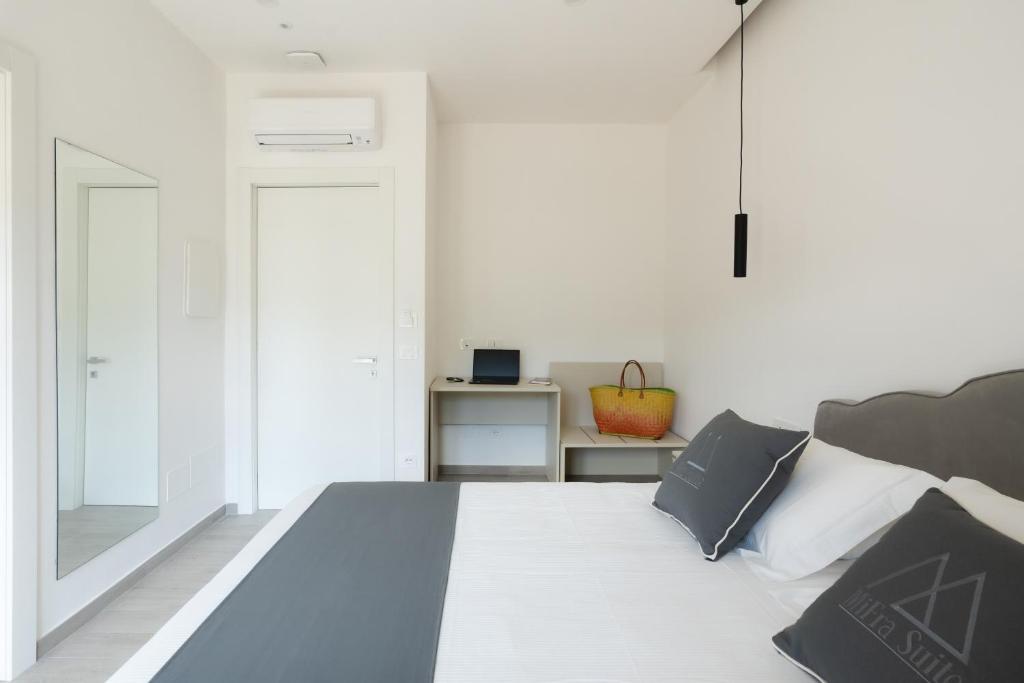 Postel nebo postele na pokoji v ubytování MIFRA SUITES
