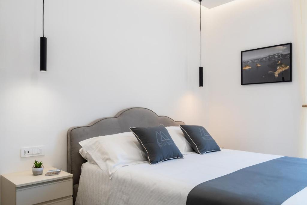 Postel nebo postele na pokoji v ubytování MIFRA SUITES