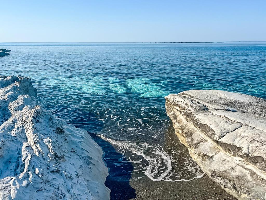a view of the ocean from a rocky shore at Cyprus Villages Hotel & Restaurant - Central Location - Bed & Breakfast - With Access To Pool And Stunning Views in Tochni