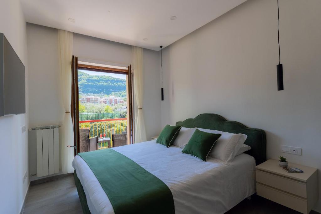 Postel nebo postele na pokoji v ubytování MIFRA SUITES