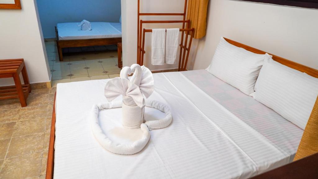 Postel nebo postele na pokoji v ubytování Seven Lotus Villa Kandy