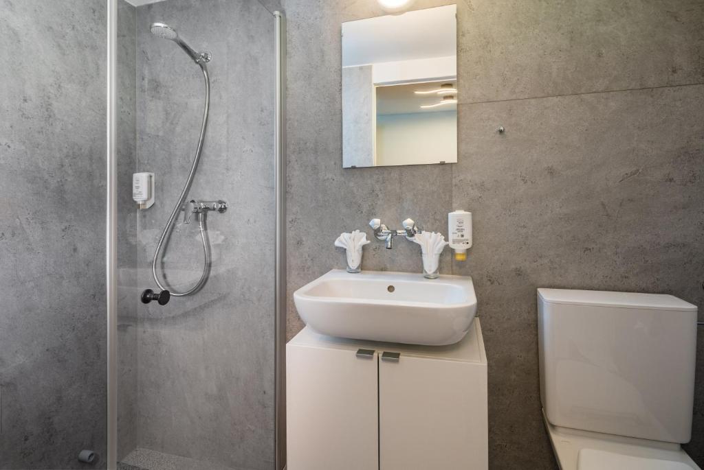 Ванная комната в Hotel Lindenhof by Crossworld AG