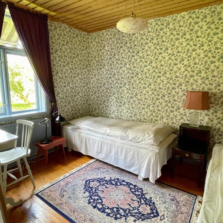 Postel nebo postele na pokoji v ubytování Klefstad gård
