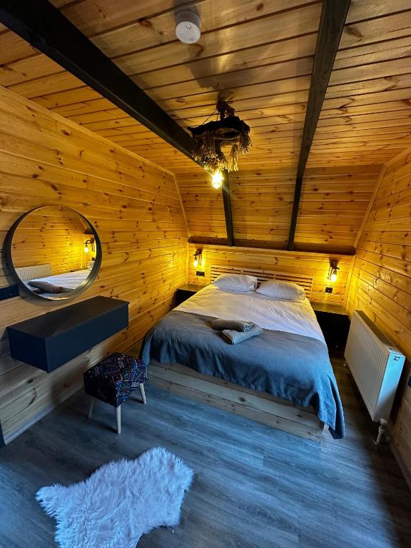 Postel nebo postele na pokoji v ubytování Peleri Suit Bungalow