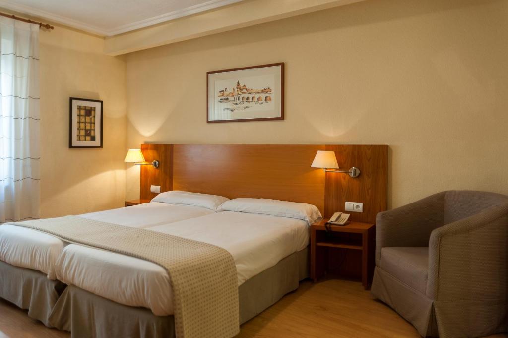 Postel nebo postele na pokoji v ubytování Hotel Mercado by gaiarooms