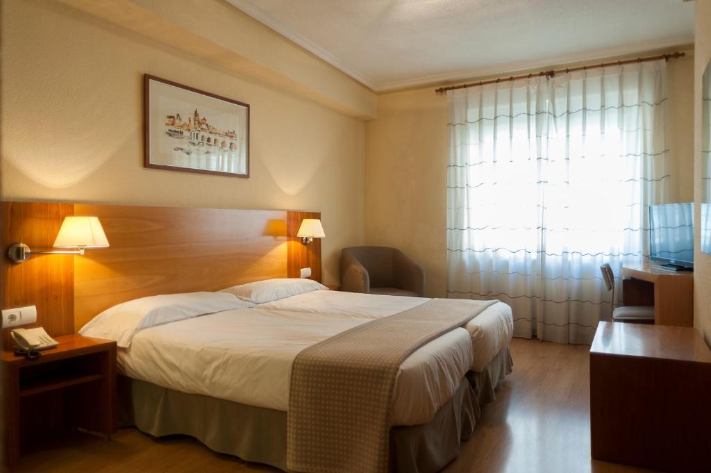 Postel nebo postele na pokoji v ubytování Hotel Mercado by gaiarooms
