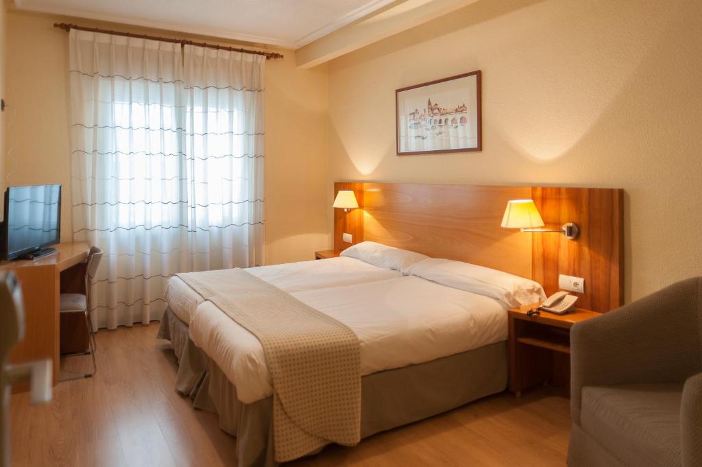 Postel nebo postele na pokoji v ubytování Hotel Mercado by gaiarooms