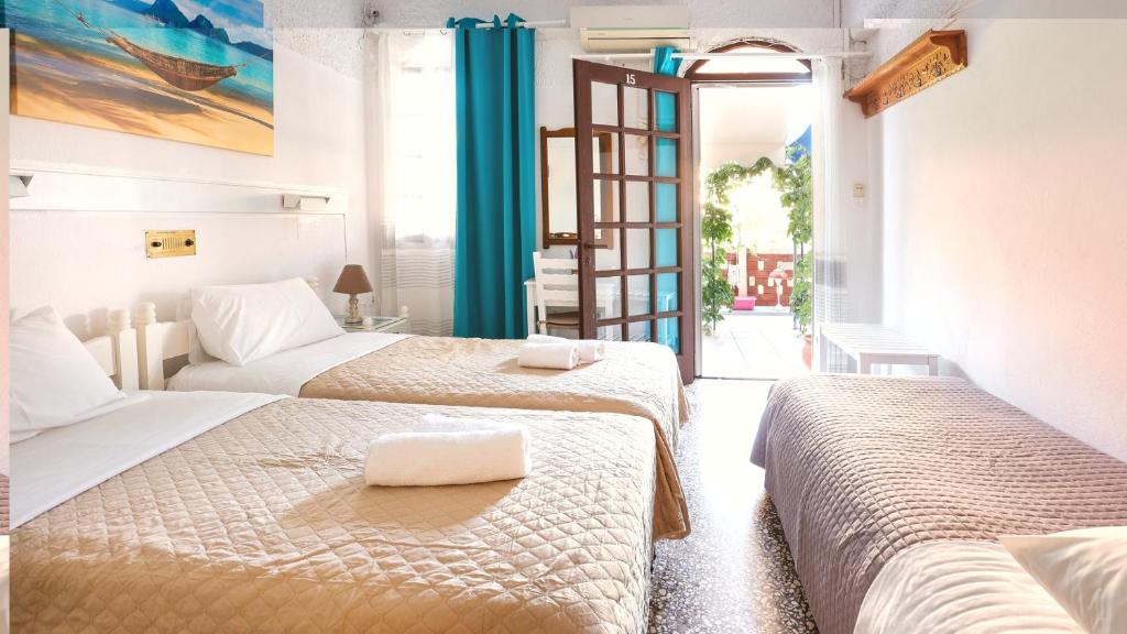 Postel nebo postele na pokoji v ubytování Melissani hotel