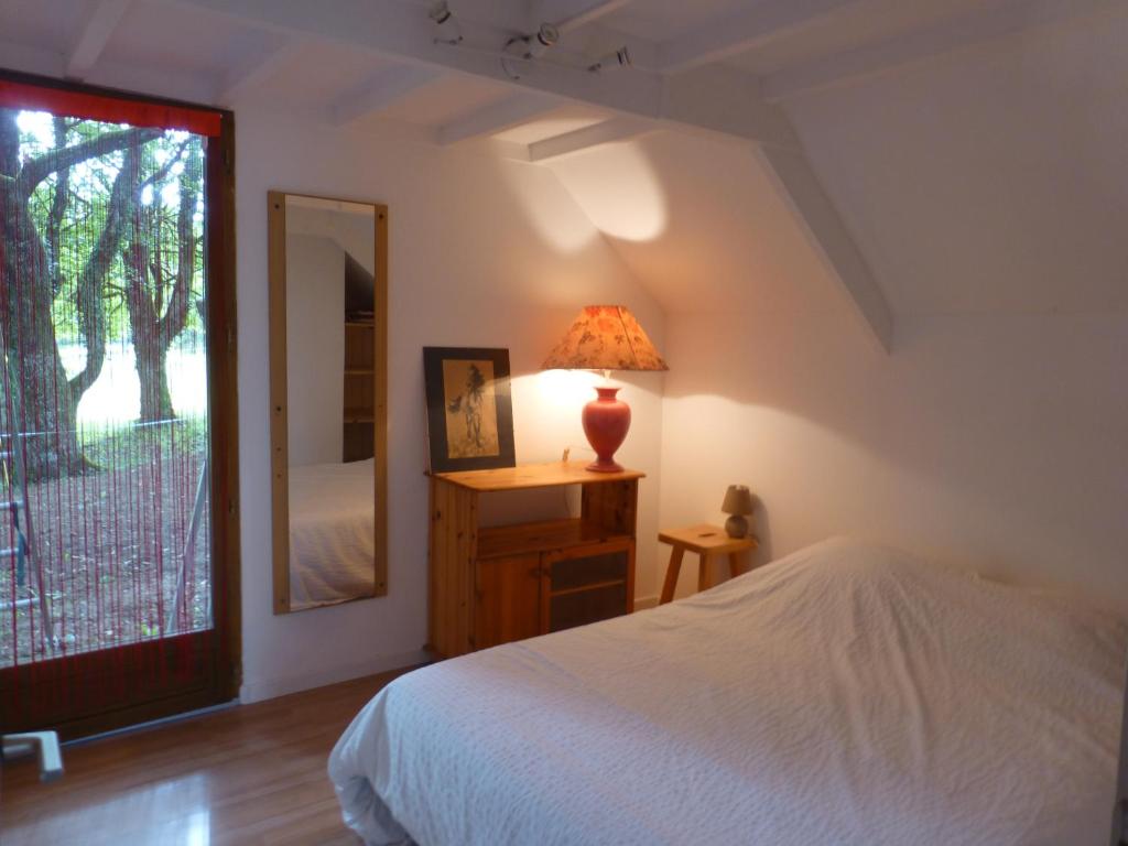 Postel nebo postele na pokoji v ubytování Gîte du Colombier