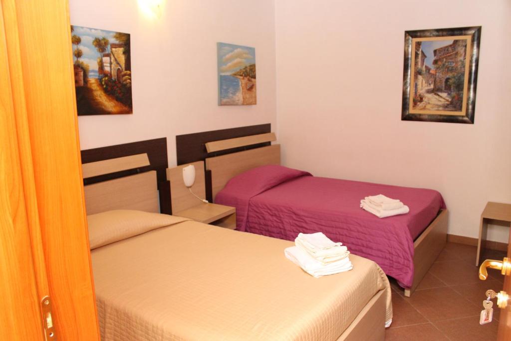 A bed or beds in a room at Terra del Sole Vittoria