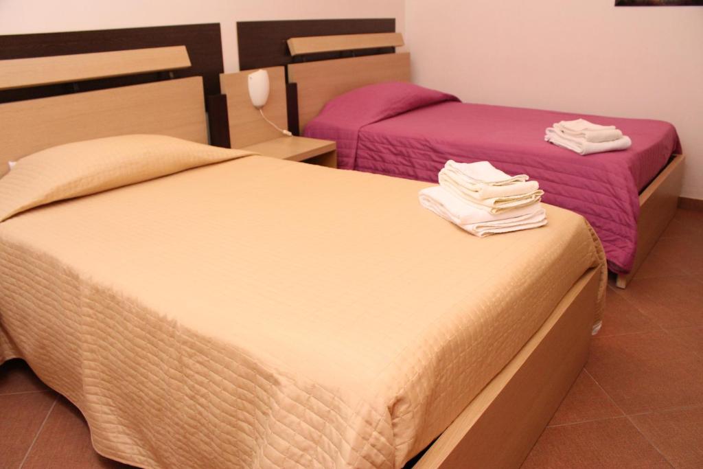 A bed or beds in a room at Terra del Sole Vittoria
