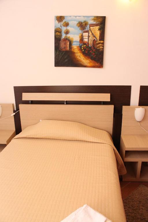A bed or beds in a room at Terra del Sole Vittoria
