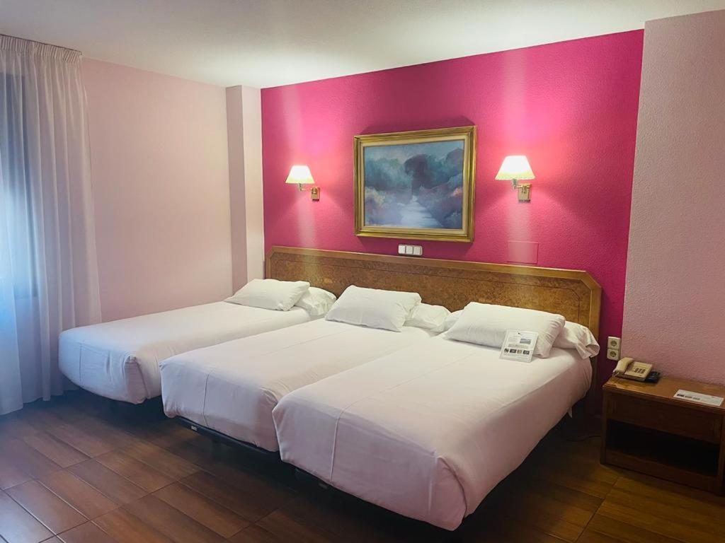 Postel nebo postele na pokoji v ubytování Hotel Don Carmelo