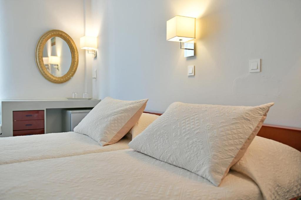 Postel nebo postele na pokoji v ubytování Greco Hotel