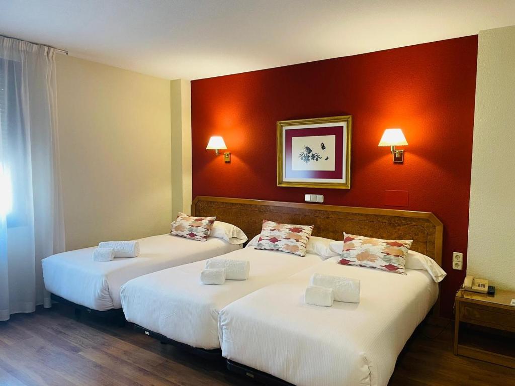 Postel nebo postele na pokoji v ubytování Hotel Don Carmelo
