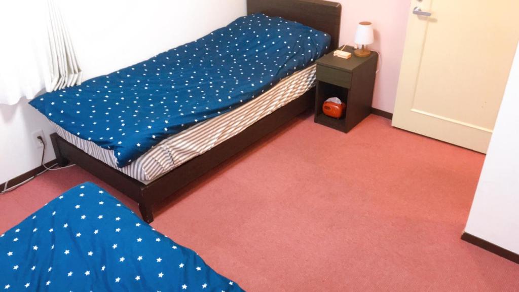 Postel nebo postele na pokoji v ubytování Hotel Yuni Star-Club
