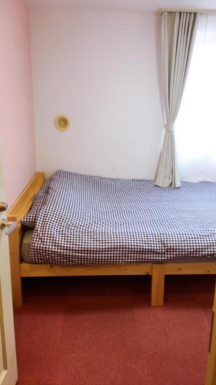 Postel nebo postele na pokoji v ubytování Hotel Yuni Star-Club