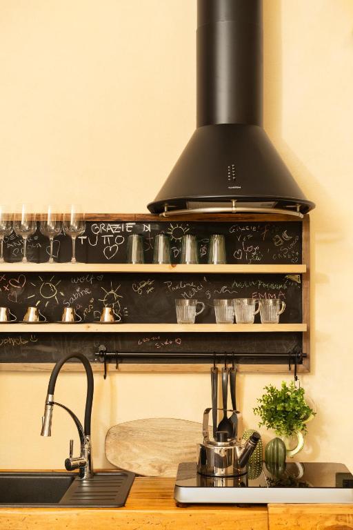 A kitchen or kitchenette at Ai due Mori Apt by Addler House Ospitality