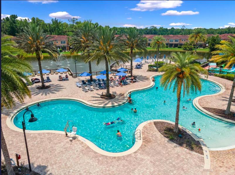 an overhead view of a swimming pool at a resort at Camaro in Orlando