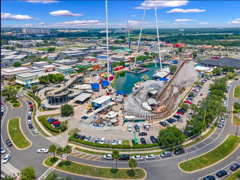 an aerial view of a park with a roller coaster at Camaro in Orlando