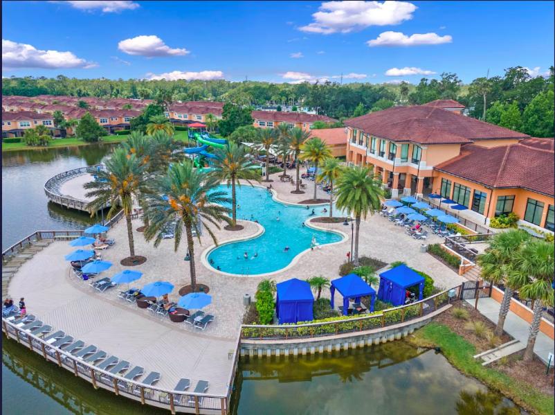 an aerial view of a resort with a swimming pool at Camaro in Orlando