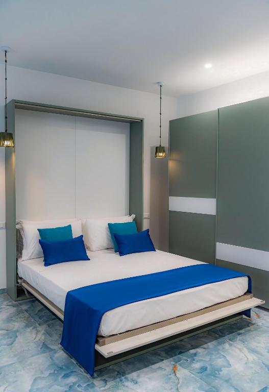 Postel nebo postele na pokoji v ubytování Maison Matie B&B Ercolano