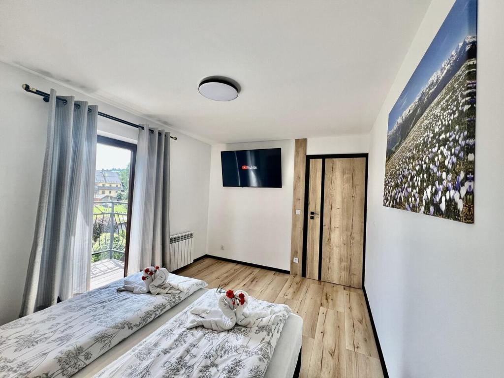 Łóżko lub łóżka w pokoju w obiekcie Pod Sosnami Termy 450m -20 procent na Termy